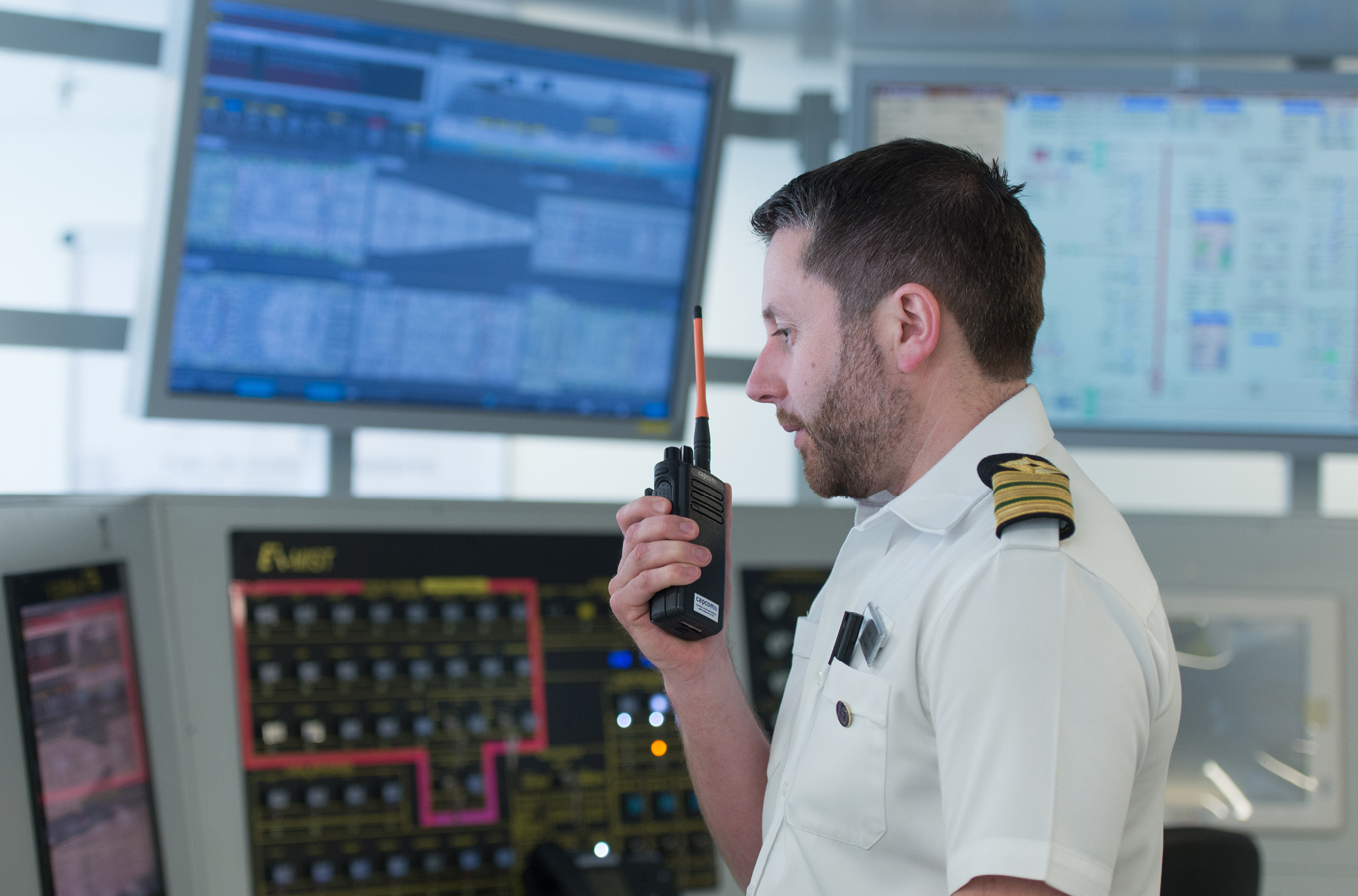 Seafarer working at a ship command centre